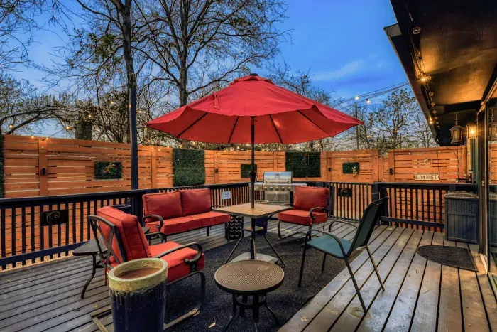 Outdoor lounge with shaded seating and ambient lighting, ideal for winding down after a day in Georgetown