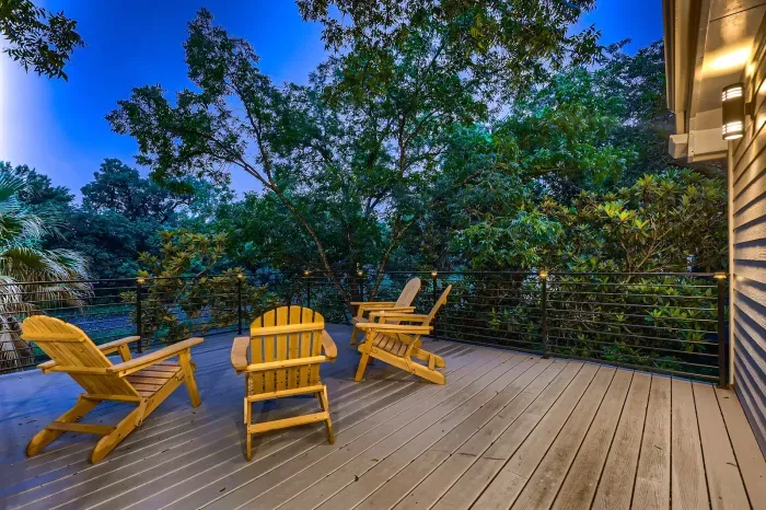 5. Backyard with a spacious deck and a dining area, ideal for hosting family dinners or casual get-togethers.