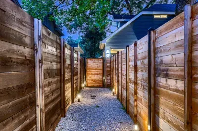 Spacious backyard with a patio, perfect for outdoor dining or relaxing in the sun.