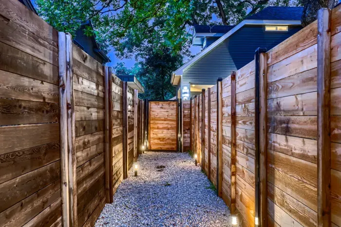 Spacious backyard with a patio, perfect for outdoor dining or relaxing in the sun.