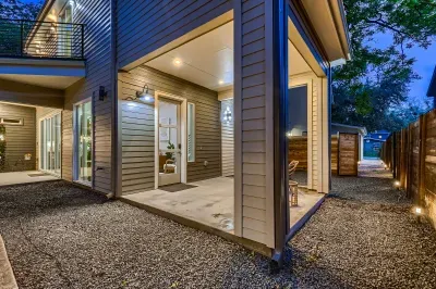 Elegant patio with a stylish outdoor dining set and a beautiful view, perfect for hosting guests.