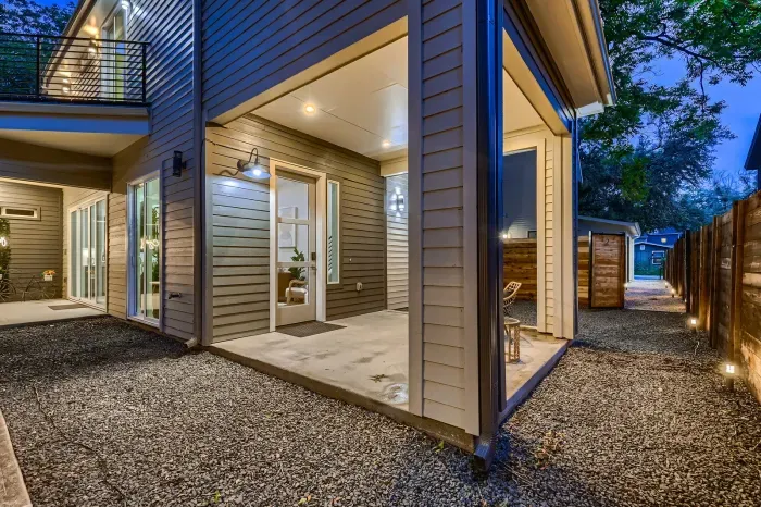 Elegant patio with a stylish outdoor dining set and a beautiful view, perfect for hosting guests.