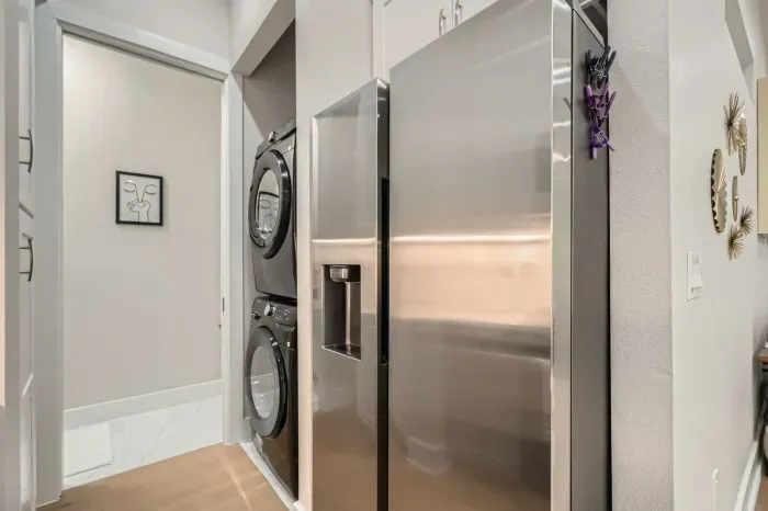 Convenient laundry area with a washer and dryer, making packing a breeze.