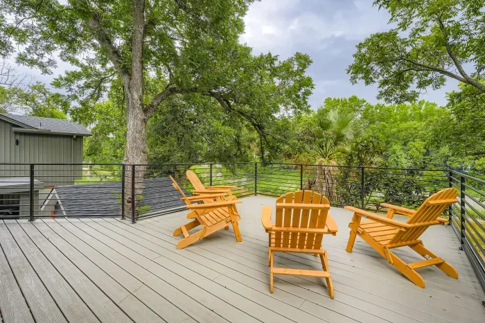Private backyard oasis featuring a large deck, and comfy seating for cozy evenings.