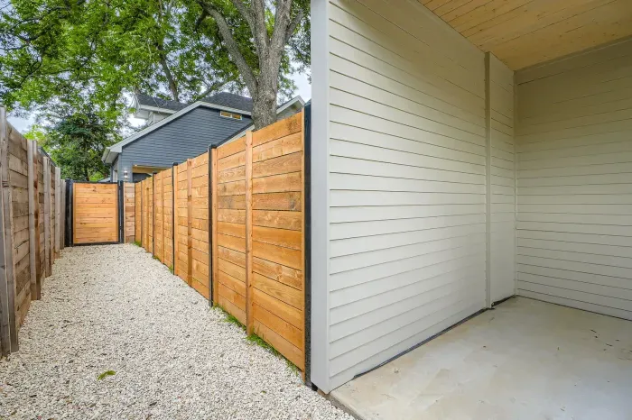 Escape to the spacious backyard, offering a peaceful retreat with outdoor seating and room to relax under the open sky.