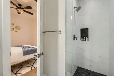 Cozy bathroom with a walk-in shower and chic, minimalist design.