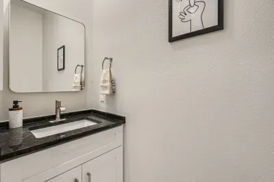 Simple yet elegant bathroom with a minimalist design and all the essentials.