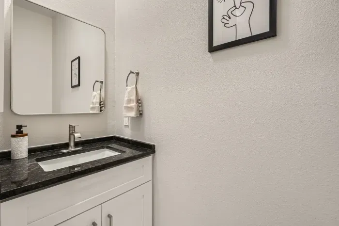 Simple yet elegant bathroom with a minimalist design and all the essentials.