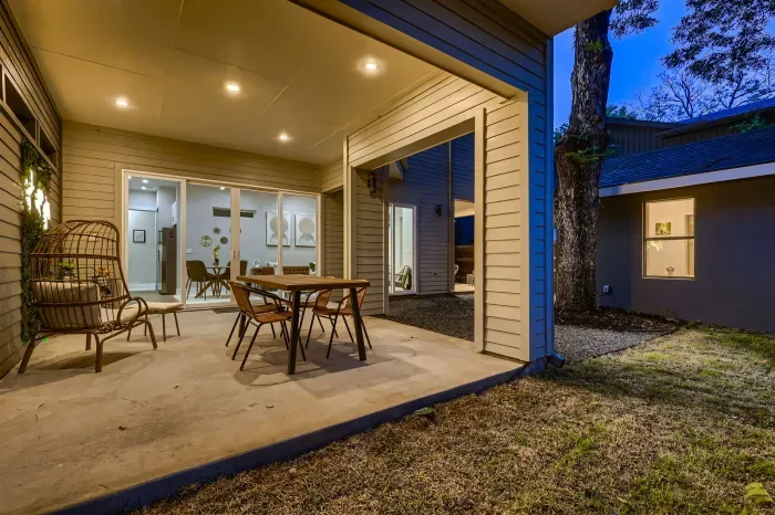 6. Sun-drenched backyard with plenty of seating for ultimate relaxation.