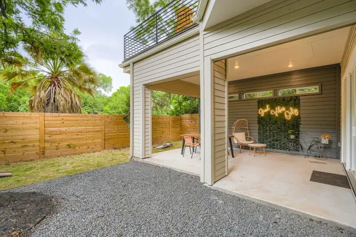 Relaxing patio with a mix of comfortable lounge chairs and soft lighting for an intimate setting.