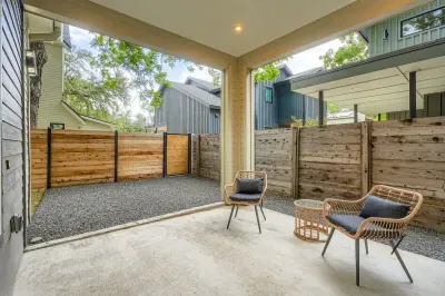Relax on the inviting porch, complete with cozy seating, a perfect spot to enjoy your morning coffee.