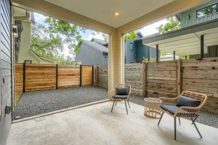 Relax on the inviting porch, complete with cozy seating, a perfect spot to enjoy your morning coffee.