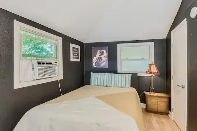 Peaceful bedroom with a plush queen-sized bed and soft linens for a restful night’s sleep.