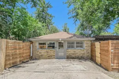 Timeless and elegant home with classic architectural details and a lush front lawn.