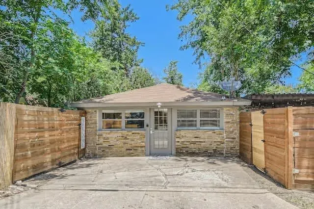 Timeless and elegant home with classic architectural details and a lush front lawn.