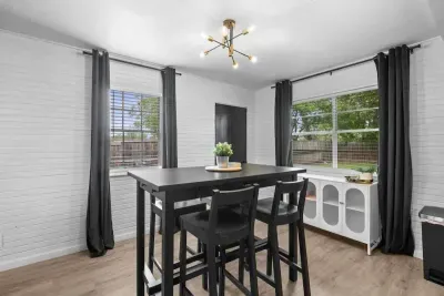 "Enjoy a versatile dining and workspace area, perfect for both meals and productivity. The dining table provides a comfortable spot for family meals, while the dedicated workspace ensures you have a functional area for work or study, all within a wel