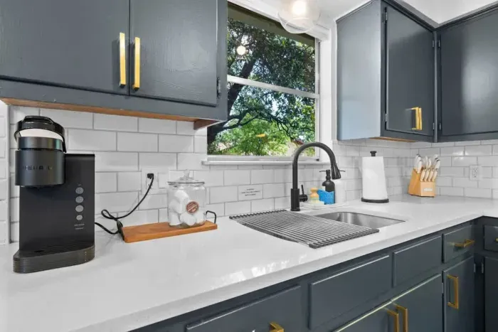 Modern kitchen equipped with a Keurig coffee maker, perfect for brewing your favorite cup of coffee in seconds. With sleek finishes and functional design, this kitchen combines convenience and style, making it the ideal space for preparing meals and