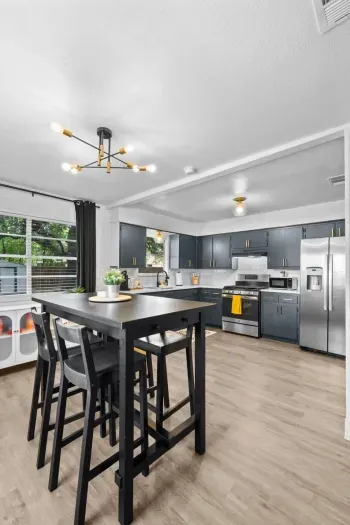 "Enjoy a versatile dining and workspace area, perfect for both meals and productivity. The dining table provides a comfortable spot for family meals, while the dedicated workspace ensures you have a functional area for work or study, all within a wel