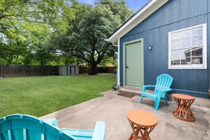 Step outside to the side hangout and grill area, conveniently located off the dining and kitchen. This space is perfect for casual meals, barbecues, and socializing, offering a seamless flow from the indoor to the outdoor living areas.