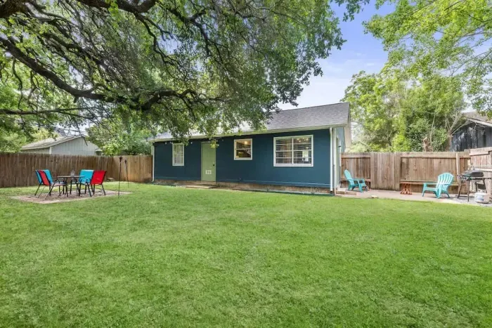 Enjoy the expansive backyard, featuring multiple hangout spaces perfect for relaxation and entertainment. From cozy seating areas to open spaces for activities, this versatile outdoor retreat offers something for everyone to unwind and enjoy.