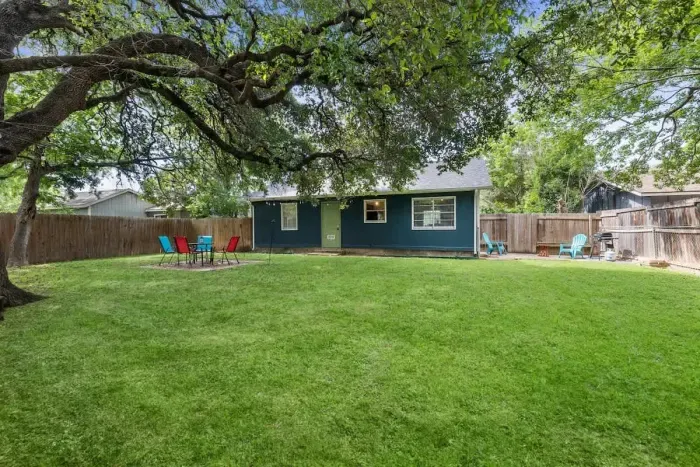 Enjoy the expansive backyard, featuring multiple hangout spaces perfect for relaxation and entertainment. From cozy seating areas to open spaces for activities, this versatile outdoor retreat offers something for everyone to unwind and enjoy.