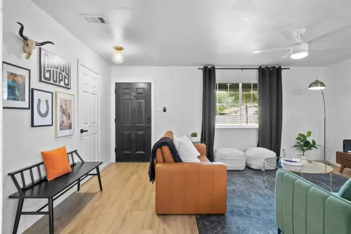 Elegant foyer leading into a spacious living room, creating a warm and inviting entry to your home. The open layout offers a seamless flow, with stylish décor and comfortable seating. Ideal for both welcoming guests and relaxing, this space blends ch