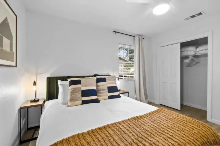 Peaceful bedroom with a plush queen-sized bed and soft linens for a restful night’s sleep.