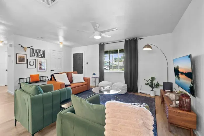 Equipped with a large TV, cozy seating, and space for everyone.