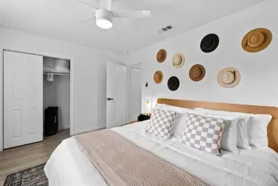 Cozy and inviting bedroom featuring a comfortable mattress and stylish decor.