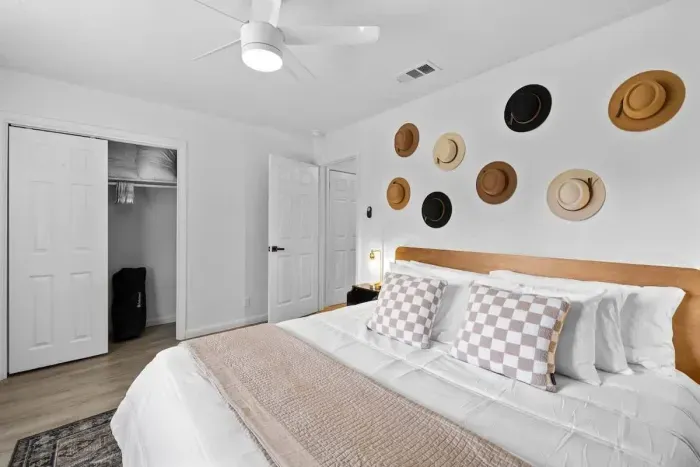 Cozy and inviting bedroom featuring a comfortable mattress and stylish decor.