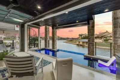 Serenity meets style in our backyard, featuring a stunning pool and cozy seating.