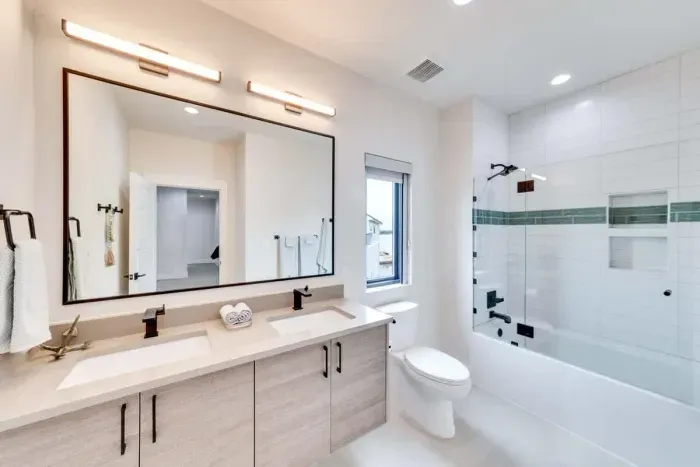 Bright and airy bathroom with plenty of counter space and stylish decor.