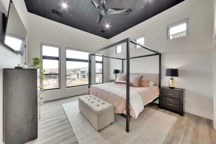 Romantic Primary bedroom with elegant lighting and soft, neutral tones.