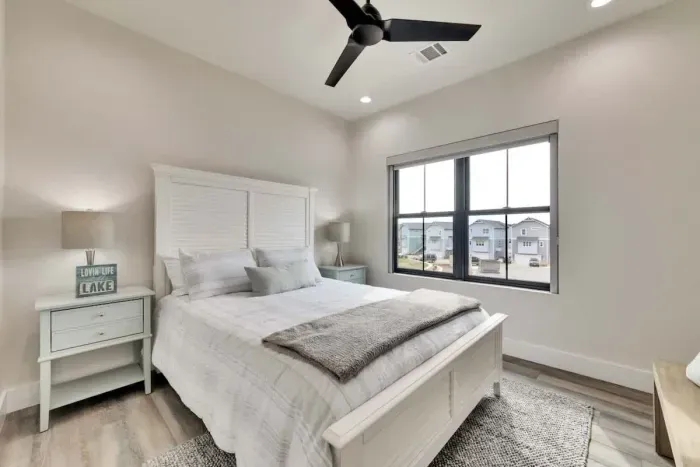 Serene secondary bedroom with calming colors and thoughtfully chosen furnishings.