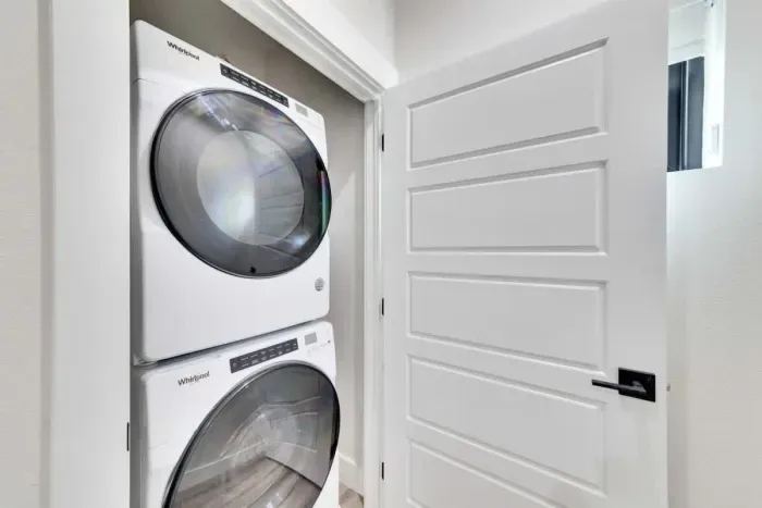 Convenient laundry area with a washer and dryer, making packing a breeze.