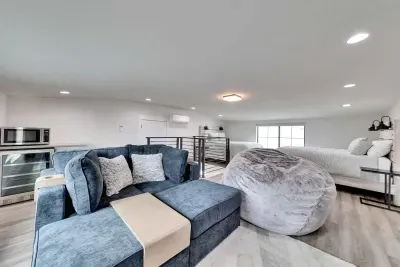 Relax in this stylish loft with cozy seating, plush bedding, and a convenient kitchenette; perfect for a comfortable stay!