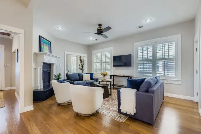 Spacious living room with plush seating and natural light.