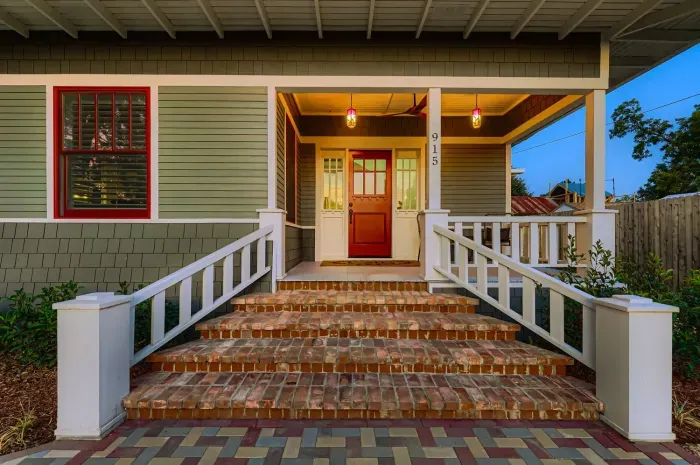 Grand front steps and entryway with inviting design.