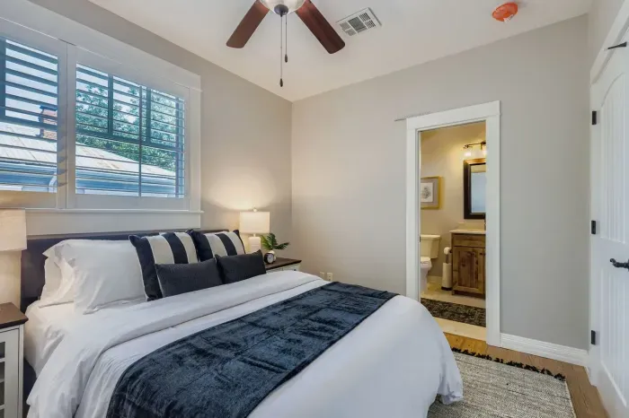 Peaceful bedroom retreat with soft lighting and comfort.