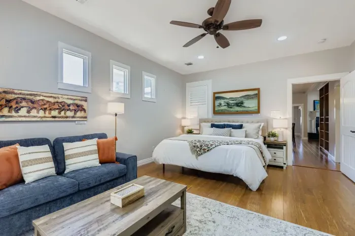 Stylish guest bedroom with cozy seating nook.