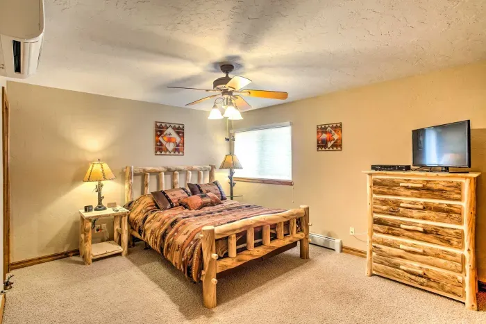 This bedroom features a plush bed, soft linens, and calming decor to ensure a restful night’s sleep.