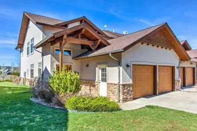 Welcoming entrance with charming curb appeal and lush landscaping.