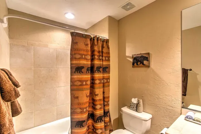 Bright and fresh bathroom with a combination tub and shower, perfect for unwinding.