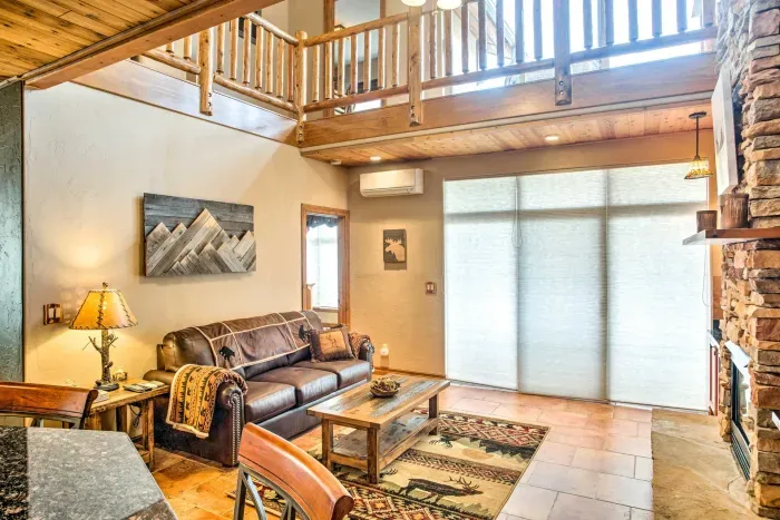 Spacious and bright living room with large windows and serene views.