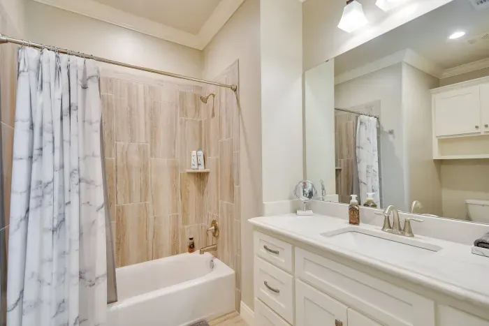 Stylish bathroom with walk-in shower and elegant fixtures.