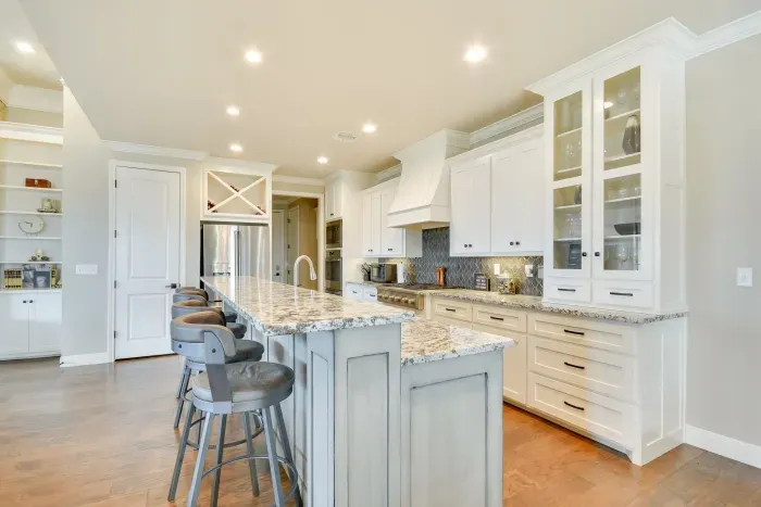 Modern kitchen with bar seating and custom cabinetry.