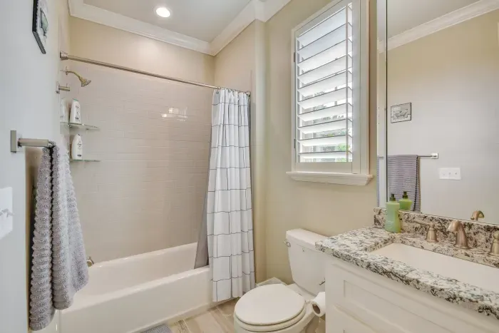 Sparkling clean bathroom with modern fixtures and bright lighting.