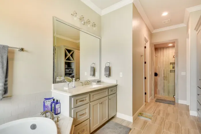 Stylish bathroom with walk-in shower and elegant fixtures.