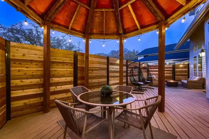 Elegant patio with a stylish outdoor dining set and a beautiful view, perfect for hosting guests.