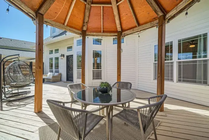 Bright and sunny patio with plenty of space for lounging or enjoying a meal outdoors.